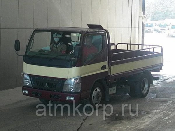 Фото Грузовик бортовой MITSUBISHI CANTER кузов FE70D год выпуска 2010 грузоподъемность 2 тонны пробег 239 тыс км