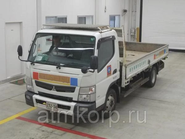 Фото Грузовик бортовой MITSUBISHI CANTER кузов FEB90 гв 2012 багажник грузоподъемность 4 тн пробег 113 тыс км