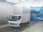 фото Грузовик бортовой тентованный MITSUBISHI CANTER гв 2010 груз 1,5 тн объем 15,23 куб м пробег 82 т.км