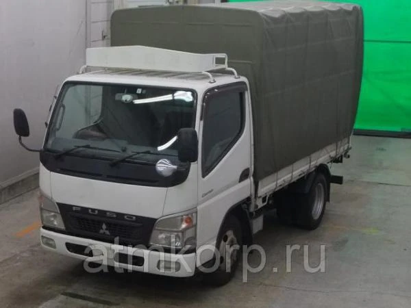 Фото Грузовик бортовой тентованный MITSUBISHI CANTER кузов FE70D гв 2009 багажник груз 2 тн пробег 341 т.км