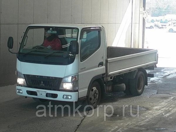 Фото Грузовик бортовой MITSUBISHI CANTER кузов FE70BS год выпуска 2009 грузоподъемность 2 тонны пробег 200 т.км