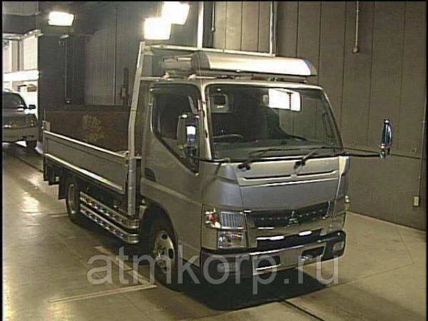 Фото Грузовик бортовой MITSUBISHI CANTER 2012 гидроборт 500 кг багажник полный привод 4х4 груз 2 тн пробег 99 т.км