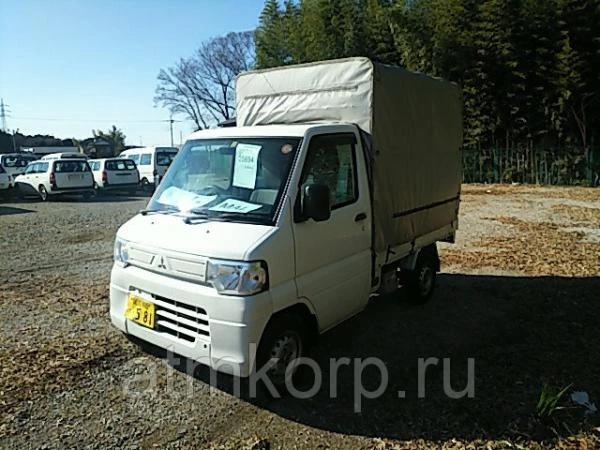 Фото Микрогрузовик бортовой тентованный MITSUBISHI MINICAB TRUCK кузов U61T гв 2013 груз 0,35 тн пробег 66 т.км