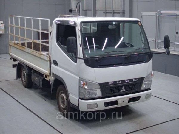 Фото Грузовик бортовой MITSUBISHI CANTER кузов FD70B гв 2011 полный привод 4х4 грузопод 1,5 тн пробег 252 т.км