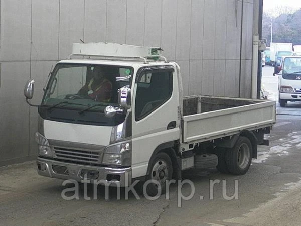 Фото Грузовик бортовой MITSUBISHI CANTER кузов FE70B гв 2010 багажник грузоподъемность 2 тн пробег 278 т.км