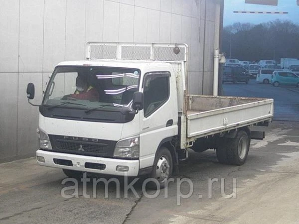 Фото Грузовик бортовой MITSUBISHI CANTER кузов FE83DY год выпуска 2010 грузоподъемность 4 тонны пробег 137 тыс км