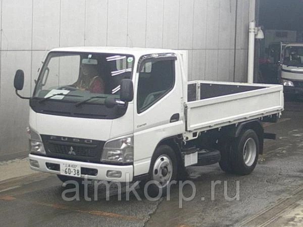 Фото Грузовик бортовой MITSUBISHI CANTER кузов FE73B год выпуска 2011 грузоподъемность 2 тонны пробег 28 тыс км