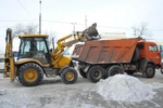 фото Погрузка снега. Фронтальные погрузчики