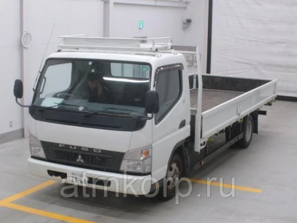 Фото Грузовик бортовой MITSUBISHI CANTER кузов FE82B гв 2009 багажник грузоподъемность 2 тн пробег 126 т.км