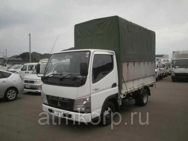 Фото Грузовик бортовой тентованный MITSUBISHI CANTER кузов FB70B гв 2010 грузопод 1,5 тн пробег 76 т.км