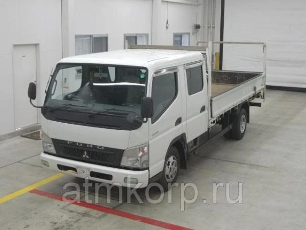 Фото Грузовик двухкабинник бортовой MITSUBISHI CANTER кузов FE82D гв 2010 кабина 6 мест груз 3 тн пробег 132 т.км