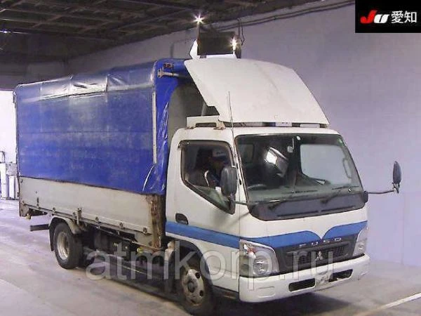 Фото Грузовик бортовой тентованный MITSUBISHI CANTER гв 2010 грузопод 3 тн пробег 483 т.км