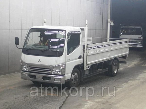 Фото Грузовик бортовой MITSUBISHI CANTER кузов FE72D год выпуска 2010 грузоподъемность 2 тонны пробег 250 тыс км