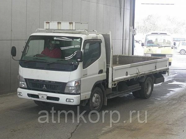 Фото Грузовик бортовой MITSUBISHI CANTER кузов FE83DY гв 2009 багажник грузопод 3,5 тн пробег 184 т.км