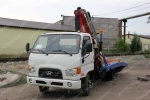 фото Hyundai HD 78 Эвакуатор с КМУ Fassi 100AT ломаная платформа