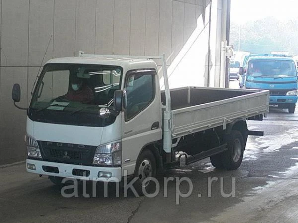 Фото Грузовик бортовой MITSUBISHI CANTER кузов FE74DV год выпуска 2010 грузоподъемность 3 тонны пробег 423 тыс км