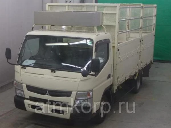 Фото Грузовик бортовой MITSUBISHI CANTER кузов FEB50 гв 2011 багажник грузопод 2 тн пробег 105 т.км