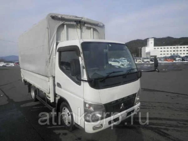 Фото Грузовик бортовой тентованный MITSUBISHI CANTER кузов FE72BS гв 2010 грузоподъемность 2 тн пробег 65 т.км