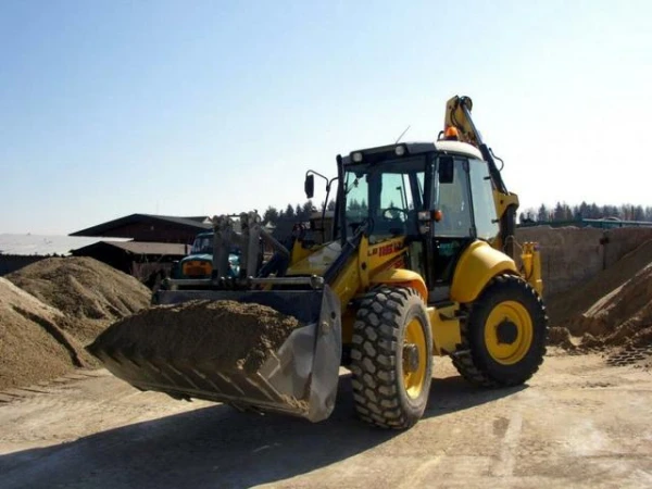 Фото Сдам в аренду экскаватор-погрузчик New Holland B115, гидромолот