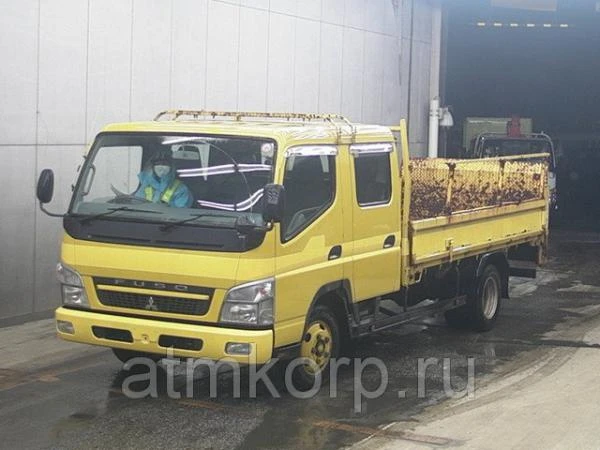 Фото Грузовик двухкабинник бортовой MITSUBISHI CANTER гв 2010 гидроборт кабина 7 м груз 2 т пробег 124 т.км