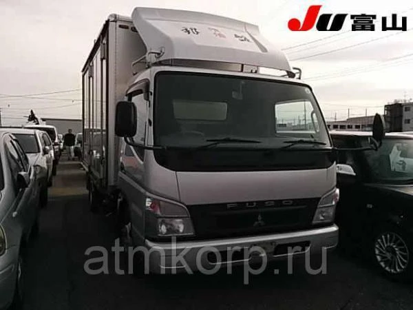 Фото Автофургон изотермический MITSUBISHI CANTER гв 2010 груз 2 т двухсторонняя разгрузка пробег 264 т.км