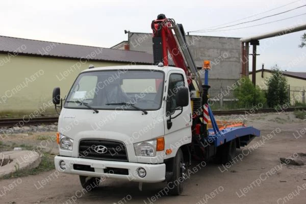 Фото Hyundai HD 78 Эвакуатор с КМУ Fassi 100AT ломаная платформа