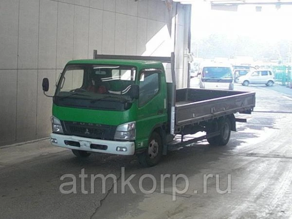 Фото Грузовик бортовой MITSUBISHI CANTER кузов FE82D год выпуска 2010 грузоподъемность 3 тонны пробег 311 тыс км