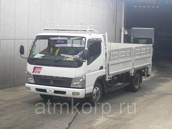 Фото Грузовик бортовой MITSUBISHI CANTER кузов FE82B гв 2010 гидроборт багажник груз 3 тн пробег 405 т.км