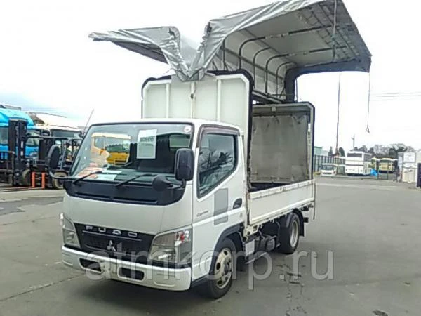 Фото Грузовик бортовой тентованный бабочка MITSUBISHI CANTER кузов FE70BS гв 2010 груз 2 т пробег 45 т.км